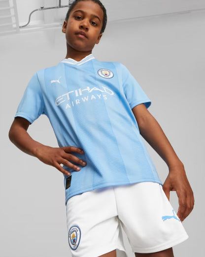 Conjunto de fútbol local del Manchester City 2023/2024 (camiseta + pantalón corto)